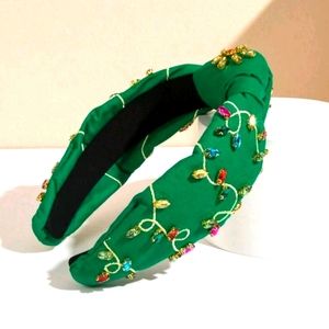 Green knot headband embroidered with stones with Christmas lights motif
